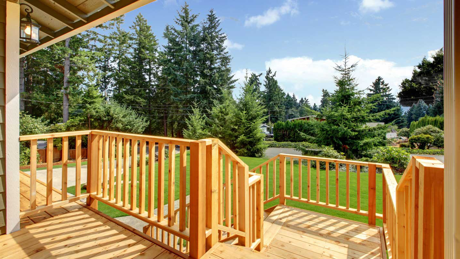 Wooden walkout deck with patio area